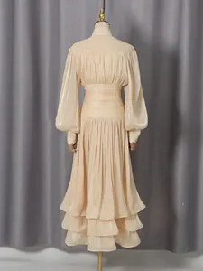 Back view of an elegant retro maxi dress with lantern sleeves and tiered ruffles