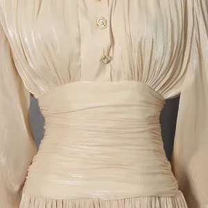 Close-up of elegant French banquet dress featuring delicate ruched waist detail.