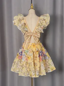 French style floral print dress with flutter sleeves and deep V-back bow detail