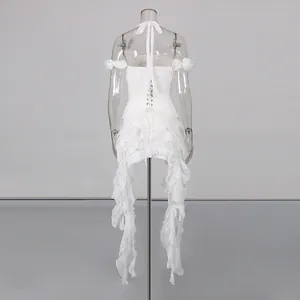 Detailed back view of white tiered ruffle dress with halter neck and lace-up design.