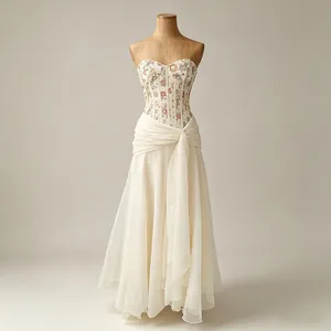 Elegant French style floral corset dress with a layered cream chiffon flowing skirt