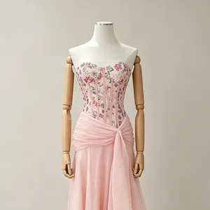 Elegant pink French style evening dress with floral corset and draped skirt detail