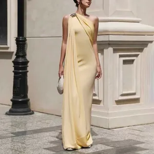 Elegant yellow one-shoulder evening gown with sophisticated pleated drape and metallic detail.