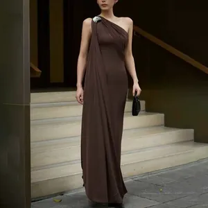 Elegant one-shoulder brown maxi dress with sophisticated draped detailing shown in full