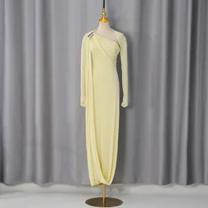 Elegant pale yellow one-shoulder evening maxi dress with long sleeves for formal events.