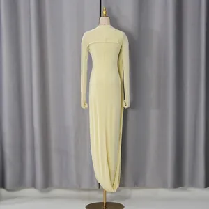 Back view of elegant French style pale yellow velvet-like long evening gown on mannequin