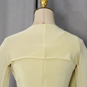 Close-up detail of the glossy textured back seam on a French style yellow gown