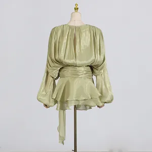Elegant metallic pleated short dress in light green with lantern sleeves and waist tie.
