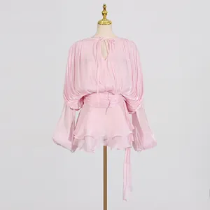 Elegant light pink pleated mini dress featuring lantern sleeves and waist tie detail