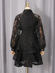 Elegant black polka dot long sleeve lace dress with tiered ruffled hem and waist tie belt