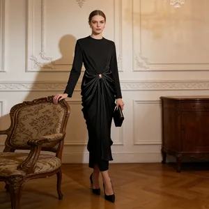 Elegant black long-sleeve dress featuring a draped satin-finish skirt and gold buckle.