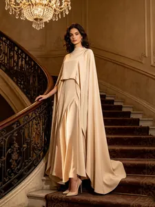 Sophisticated champagne three-piece set featuring camisole, long skirt, and elegant cape.