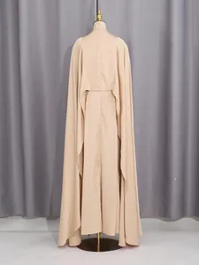 Elegant beige 3-piece clothing set featuring a long cape, camisole top, and maxi skirt.