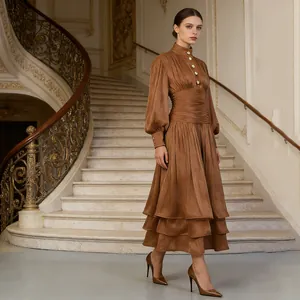 Elegant brown French style evening midi dress featuring a pleated waist and layered skirt