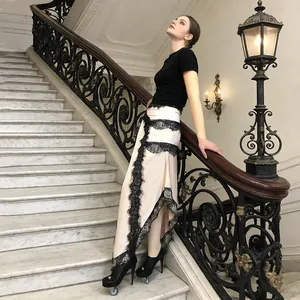 Detailed view of the elegant lace panel asymmetrical maxi dress in a classical setting.