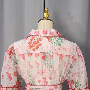 Close-up of French style pink shirt dress with tomato print showing back collar detail