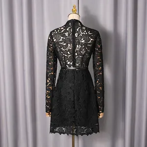 Back detail of elegant black hollow-out floral lace long sleeve mini dress
