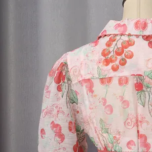 Detailed back view of a pink French style dress featuring vibrant cherry tomato prints