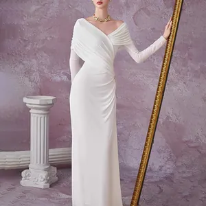 Elegant white long-sleeved pleated dress with slim fit design and draped texture.