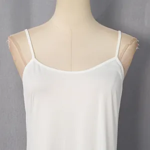 Detailed view of the white camisole neckline on mannequin for a summer slip dress