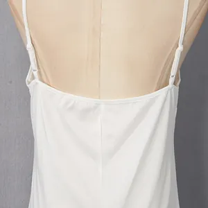 Detail of white French style dress with adjustable spaghetti straps and satin finish.
