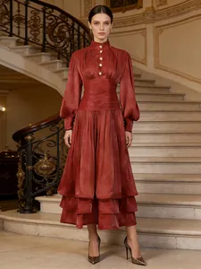 Elegant French-style rust red long-sleeved tiered evening dress with gold buttons