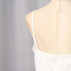 Detailed close-up of adjustable thin straps on a white French style summer dress for women