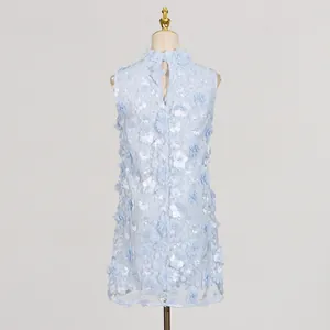 Rear view detail of light blue sleeveless mini dress with 3D floral and pearl embellishments