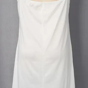 Detailed back view of a white French-style shirt dress showing smooth fabric texture