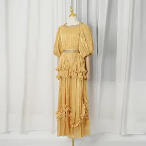 Elegant golden French vintage tiered maxi dress with pleated ruffles and balloon sleeves
