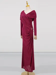 Elegant burgundy long-sleeved evening dress with pleated wrap design and metal buckle