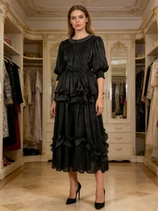 Elegant French vintage black tiered dress with a studded waist and puff sleeves for women