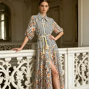 Full-length view of a French floral striped dress on a model in a luxury interior.