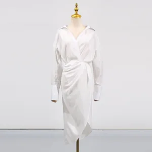 Front view of elegant white V-neck midi dress with asymmetrical split and wrap waist