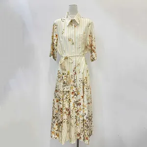 Elegant French style floral maxi dress featuring a belted waist with decorative tassel details