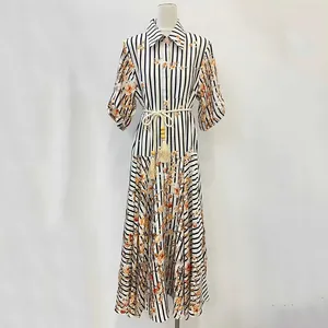 French pastoral striped dress with floral print and tassel waist tie on mannequin