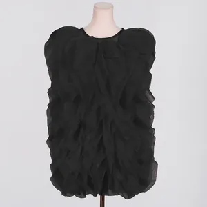 Detailed front view of a black ruffled tiered sleeveless mini dress displayed on a mannequin
