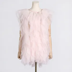 Sleeveless pink tiered ruffle tulle dress with a round neckline on a mannequin.