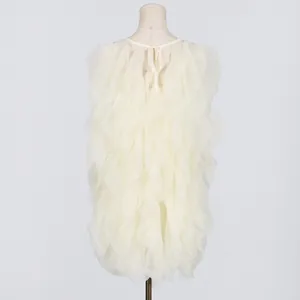 Detailed back view of a sweet white ruffled mini dress with layered tulle petals