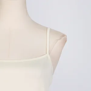 Close-up detail of slim spaghetti strap and premium fabric of a summer dress.