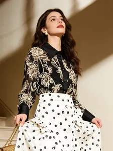 Elegant high-waisted white midi skirt with black polka dots and A-line silhouette