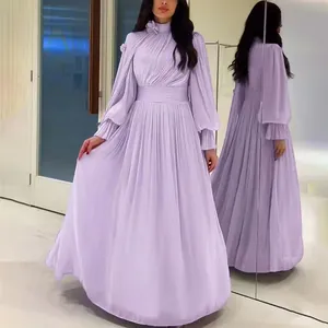 Detail view of a lavender pleated maxi dress with elegant puff sleeves and floral accent
