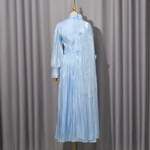 Back view of elegant light blue pleated maxi dress with floral appliques and metallic finish