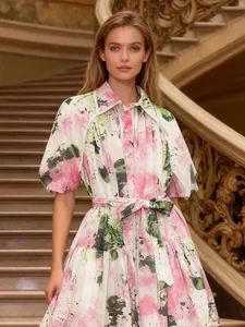 Elegant floral print puff sleeve A-line dress with waist tie on a professional model