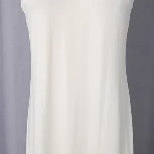 Close-up detail showing the soft white fabric texture and elegant drape of the dress.