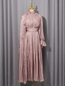 Elegant mauve pleated maxi dress with high neck and floral appliqués for a French style look