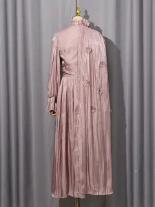 Back view of an elegant mauve pleated French-style maxi dress with floral accents for women