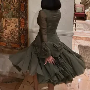 Back view of elegant olive green tiered mesh mermaid dress with sheer sleeves