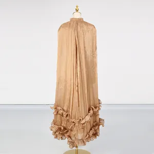 Back view of shimmering bronze pleated maxi dress with elegant ruffled tiered hem