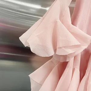Detailed view of the layered pink mesh ruffles on an elegant spring sleeveless mermaid dress